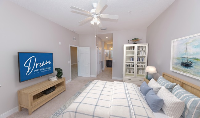 bedroom with bed, light wood furniture, coastal decor