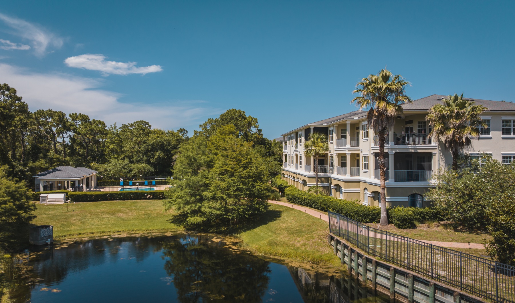 exterior aerial of building pond and pool